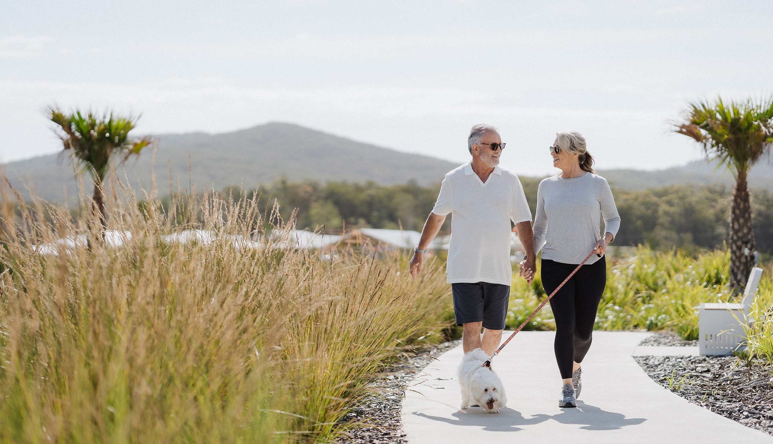 Couple walking their dog