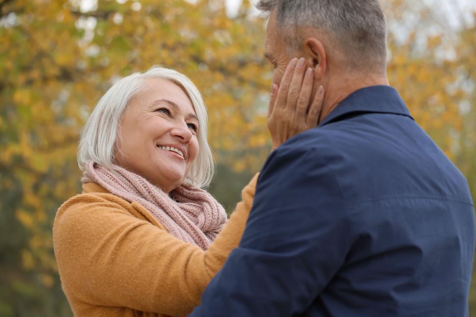 Man and woman sharing intimate outdoor moment