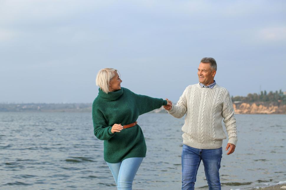 Couple walking on shoreline